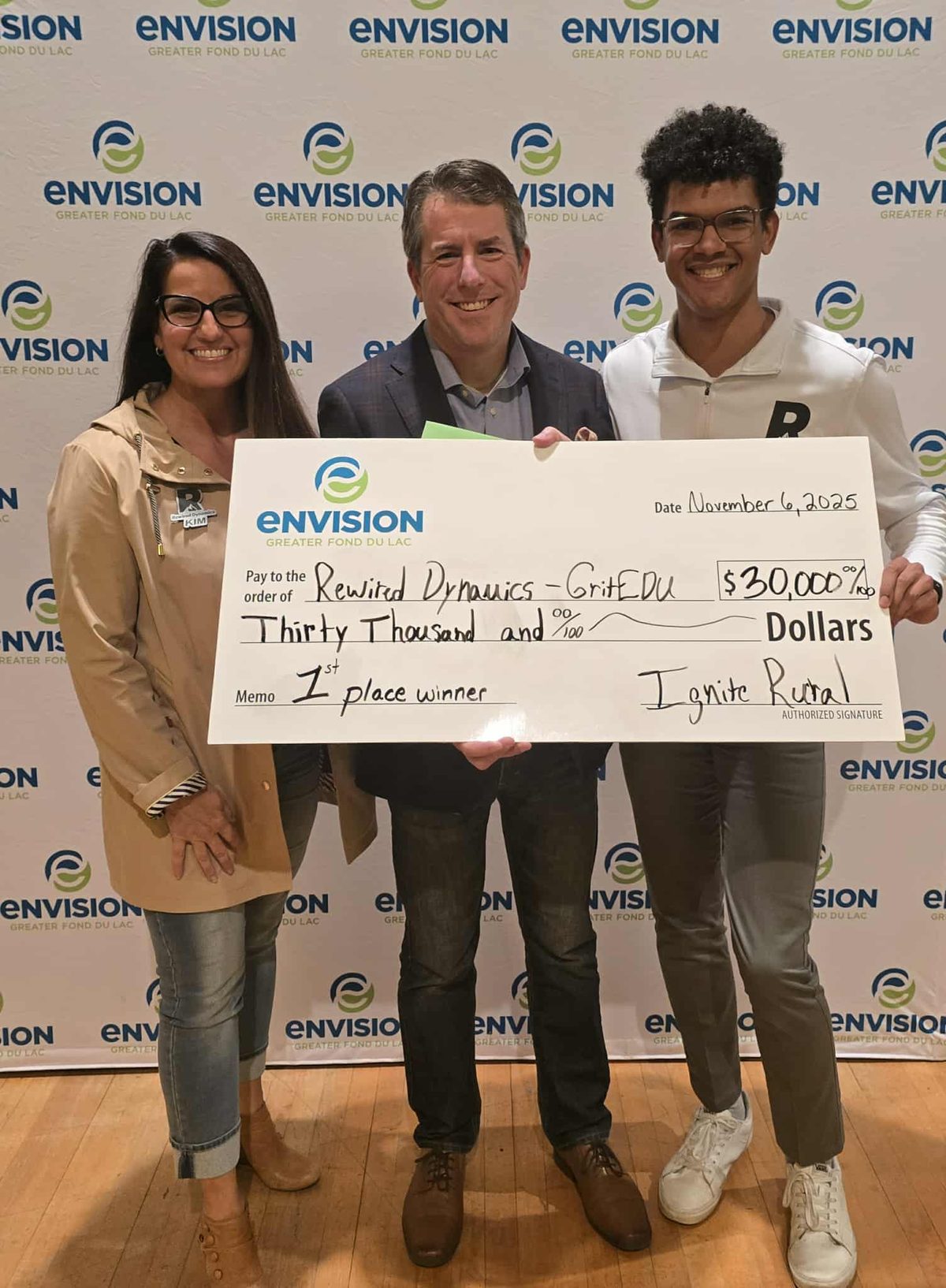 Ayden and Rewired Dynamics accepting a 30,000 dollar first place check at Ignite Rural