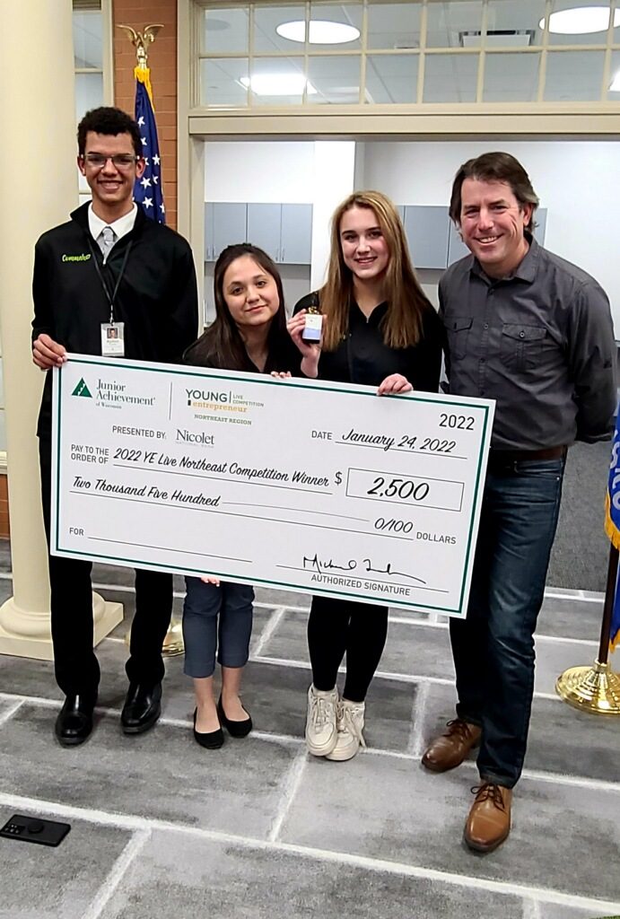 Ayden with a pitch competition winner check